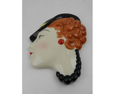 Moorland, Staffordshire. An Art Deco style ceramic wall mask in the form an elegant lady.
