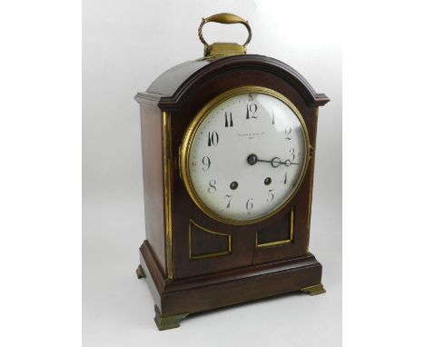 Mappin & Webb, Paris. An early 20th century French mahogany and brass mounted mantel clock, the arched pediment surmounted by