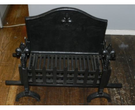 A cast iron fire grate, decorated with fleur-de-lis to back. H: 61cm W: 90cm