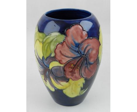 Moorcroft, England. A Hibiscus pattern vase of ovoid form, circa 1960's. H 18cm