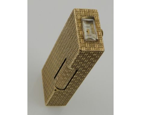 Alfred Dunhill, a 9ct gold cased lighter with basket weave design and having a clock built into the hinged lid by emewo. date