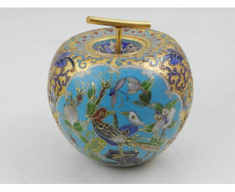 A Chinese cloisonne caddy and cover, in form of apple, decorated with gilt highlighted vignettes depicting birds and foliage.