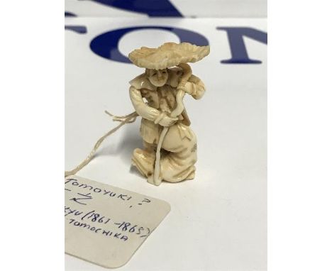 19THC CARVED IVORY NETSUKE - POSSIBLY TOMOYUKI BUNKYO 1861-1863 FIGURE OF A MAN USING PLANT AS UMBRELLA, SIGNED ON BASE