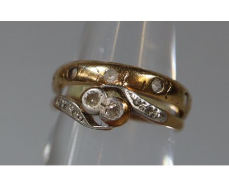 18ct gold and diamond two stone ring. Ring size L&1/2. Together with a 9ct gold white sapphire eternity style ring.  Ring siz