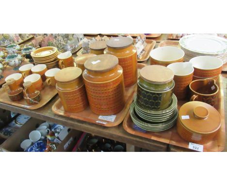 Three trays of Hornsea 'Saffron' pottery items to include; cups and saucers, utensil jars, jugs, canisters marked 'Flour', 'B