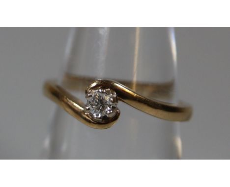 9ct gold diamond solitaire ring on a twist.  Ring size M.  Approx weight 2.6 grams.(B.P. 21% + VAT) 