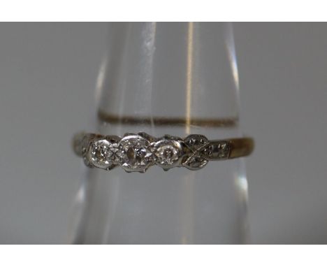 18ct gold three stone diamond ring.  Ring size M.  Approx weight 1.9 grams.(B.P. 21% + VAT) 