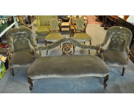 Late 19th/early 20th century walnut framed, button back upholstered parlor suite comprising a two-seater sofa and a pair of a