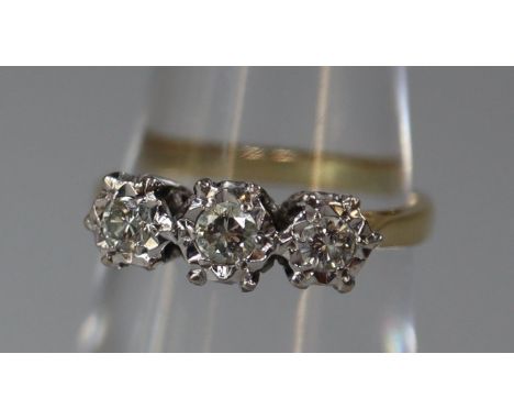 18ct gold three stone diamond ring. Ring size M. Weight approx 3.3 grams. (B.P. 21% + VAT) Condition is good. Full UK hallmar