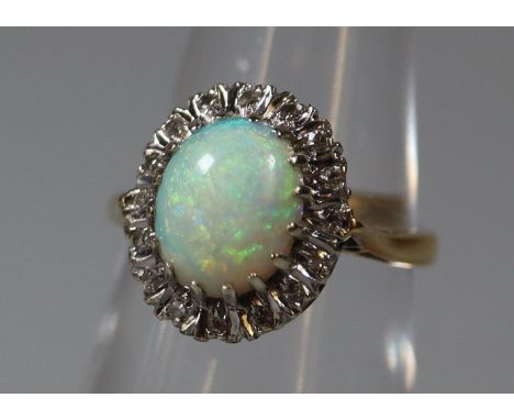 18ct gold opal and diamond ring. Ring size L. Approx weight 4.7 grams. (B.P. 21% + VAT) The whole ring is slightly bent to sh