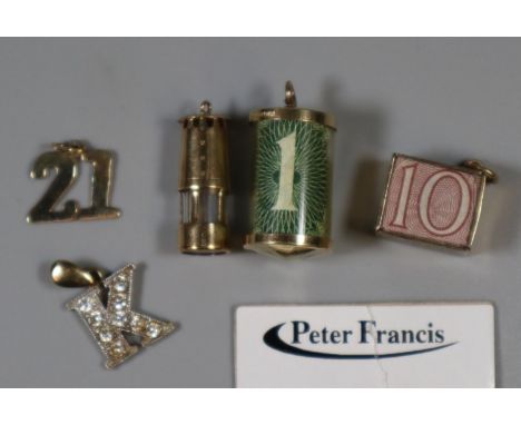 Three 9ct gold charms and two yellow metal charms.  Approx weight in total 9.8 grams.(B.P. 21% + VAT) 