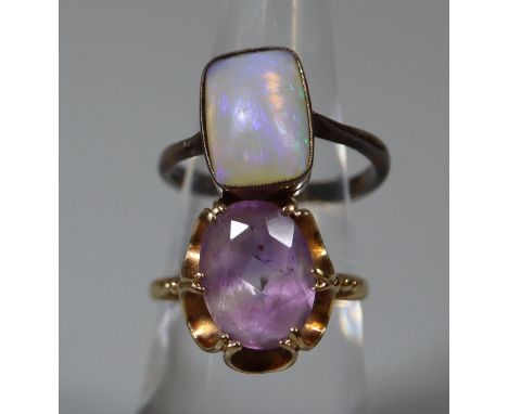 9ct gold and amethyst ring. Ring size N.  Weight approx 2.9 grams. Together with a silver and opal ring. Ring size L.(B.P. 21