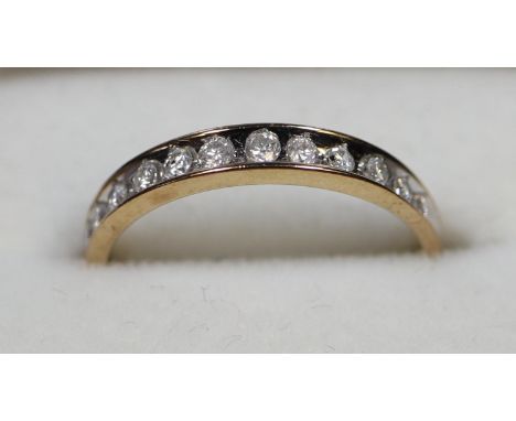 9ct gold and diamond full eternity ring. Ring size N&amp;1/2. Approx weight 1.4 grams. (B.P. 21% + VAT)