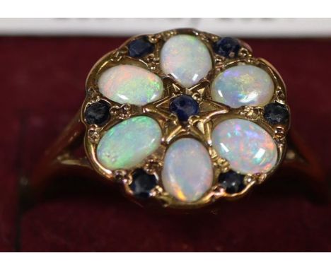 9ct gold opal and sapphire cluster ring. Ring size N. Approx weight 2.2 grams. (B.P. 21% + VAT)Sapphires scuffed to table fac