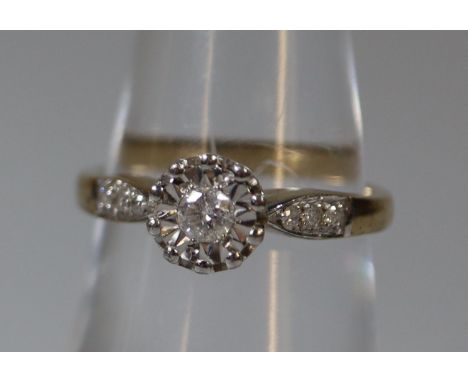 9ct gold and diamond illusion set solitaire ring with diamond shoulders.  Ring size N.  Approx weight 2.8 grams.(B.P. 21% + V