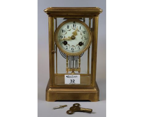 Early 20th century presentation two-train mantel clock having enamel dial with swag floral decoration, beveled glass panels. 