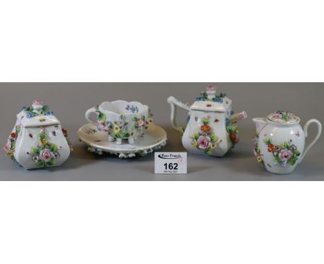 Dresden flower encrusted teapot with matching milk jug, sucriere, and teacup and saucer. (B.P. 21% + VAT)