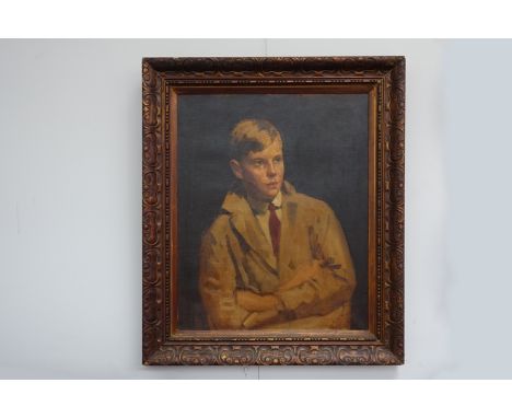 An early 20th Century oil on canvas portrait of a young boy in tan work coat. Unsigned work. Set in an ornate frame, 68cm x 5