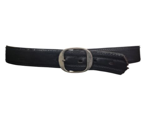 ˑ A black leather belt which was previously owned by Freddie Mercury. It is printed inside with the words Ambiance de Paris, 