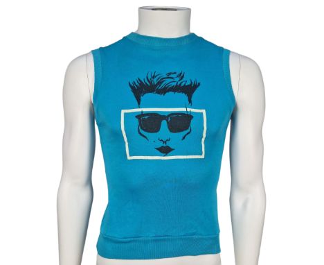 ˑ A blue sleeveless top previously owned by Freddie Mercury. Freddie owned a number of these tops in different colours, he ca