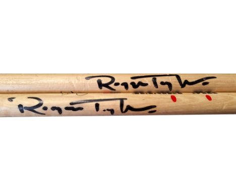 A pair of Vic Firth Roger Taylor signature drumsticks which have both been hand signed by Queen drummer Roger Taylor. He has 