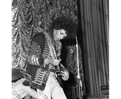 ˑ A pair of black and white negatives bearing images of Jimi Hendrix taken during a performance at the ABC Theatre, Aldershot