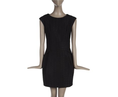 ˑ A black dogtooth patterned dress which was previously owned by Amy Winehouse. It has a Warehouse label and is a UK size 6.
