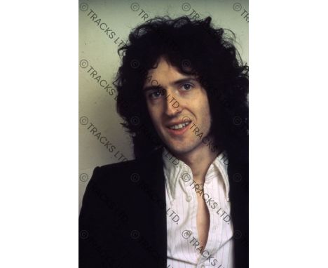 ˑ A collection of five positive transparencies of Queen. The photographs were taken by George Cooper in Freddie Mercury’s apa