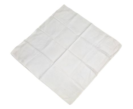 ˑ A white cotton napkin which was previously owned by Freddie Mercury. It features a damask pattern with decorative framing.

