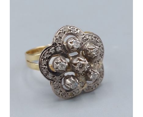 A 14ct gold Diamond cluster ring of pierced form, 4.6gms, ring size R 