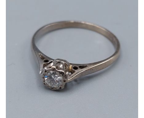An 18ct white gold solitaire Diamond ring, 2.4gms, ring size R 