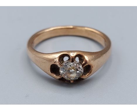 A yellow metal solitaire diamond set Gypsy ring, the single diamond claw set, approx. 0.40ct 