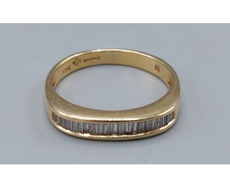 An 18ct gold Baguette Diamond half Eternity ring, 3.9gms, ring size P 
