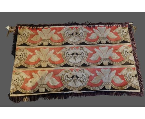A tapestry wall hanging, decorated with Fleur de Lis, together with a brass hanging rail and brackets, 87cms by 145cms 