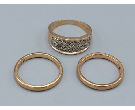 A 9ct gold diamond set dress ring together with two 9ct gold wedding bands, 9.3gms 