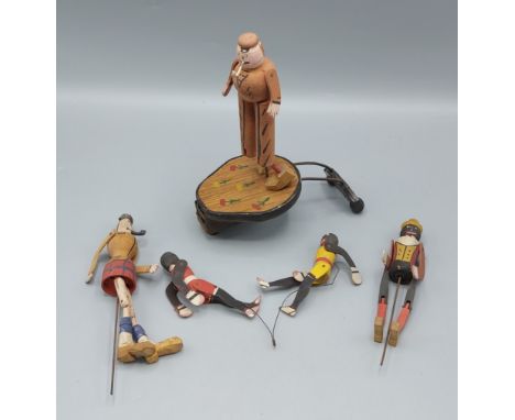 A gramophone / Phonograph painted wooden dancing toy figure, together with three other painted wooden figures to include a pa