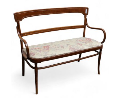 Early 20th century beech framed and bentwood bench, shaped cresting rail over rolled arms, upholstered seat in floral pattern