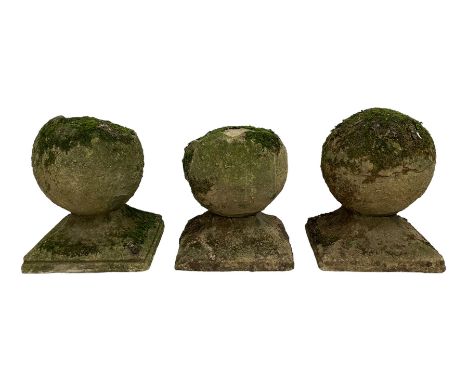 Set of three weathered cast stone gate post finials, circular orb on step-canted square base Dimensions: Height:&nbsp;33cm&nb