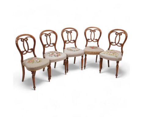 Set of five Victorian walnut balloon back dining chairs, interlaced C-scroll back over floral tapestry seat, on turned and fl