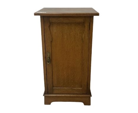 Arts and Crafts period oak pot cupboard, shaped panelled door enclosing single shelfDimensions: Height:&nbsp;77cm&nbsp; Lengt