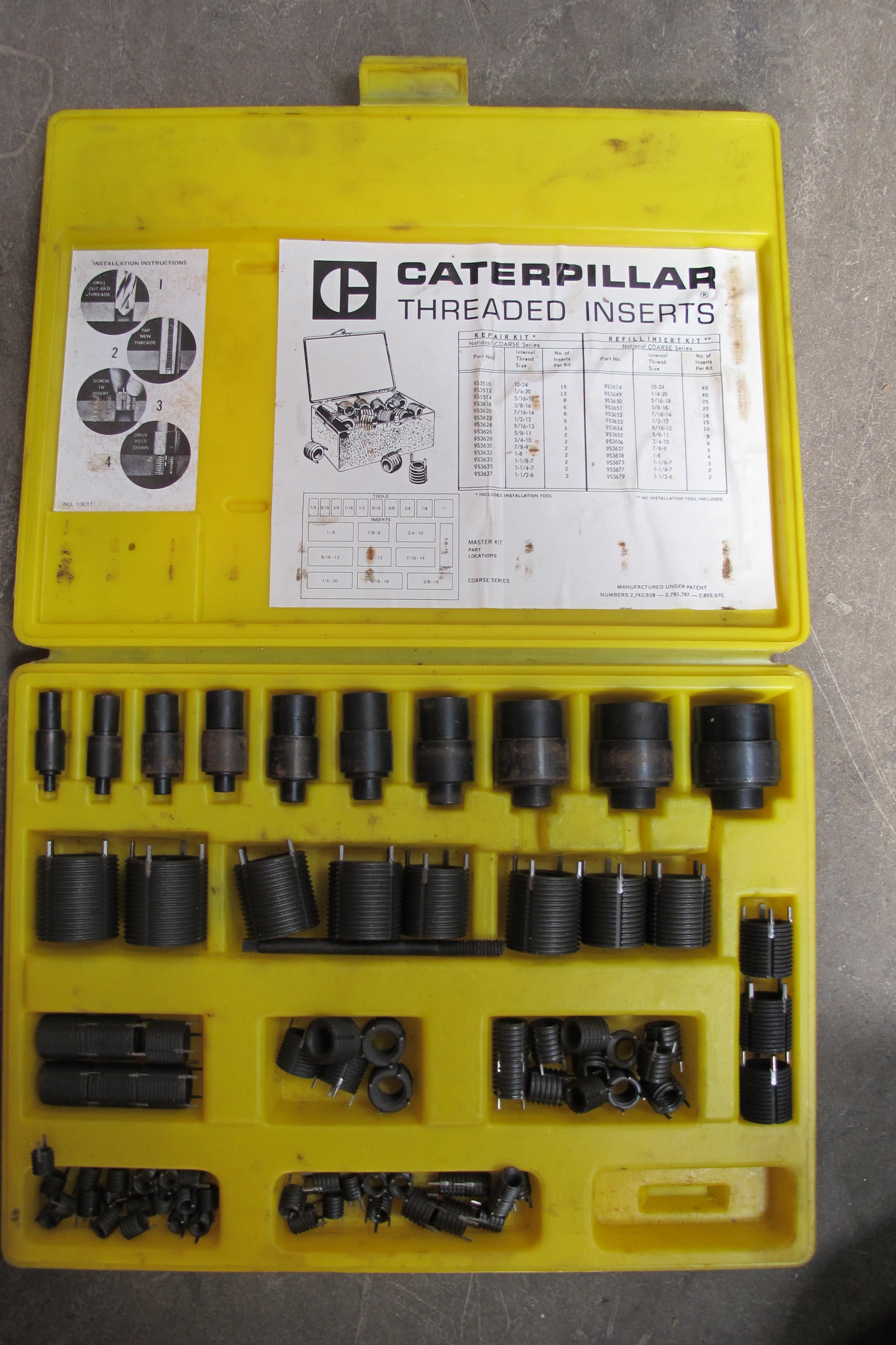* A box of Caterpillar threaded inserts