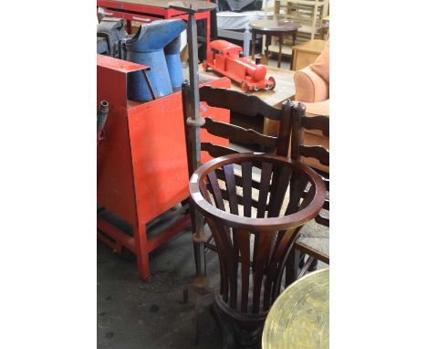Wooden basket style jardiniere stand together with a metal candlestick