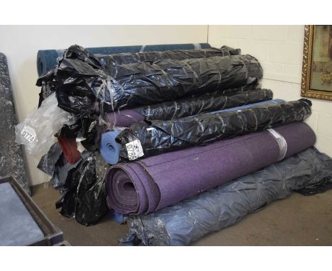 A large quantity of assorted rolls of carpet