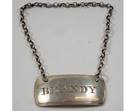A Georgian silver brandy decanter label by Peter and William Bateman, London, 1804 