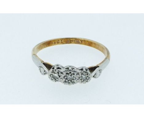 An 18 carat gold and platinum diamond set ring, size R, 2g 