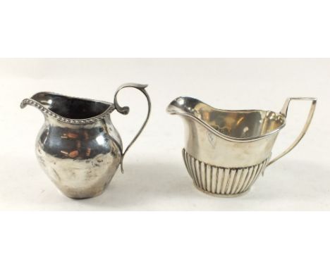 Two silver cream jugs, Birmingham 1906 and Chester (date mark rubbed), 113g 