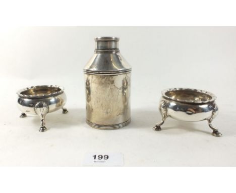 A silver cylindrical tea caddy 11 cm tall and a pair of Georgian silver salts, marks rubbed and indistinctive, 208g