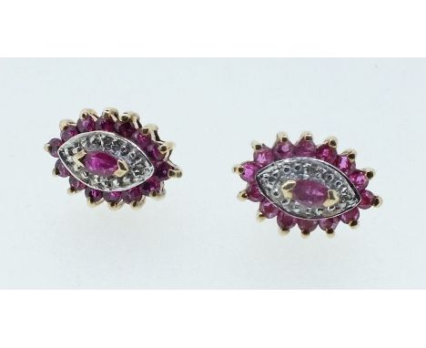 An attractive pair of marquise form diamond and ruby stud earrings, 2g, 12mm x 7mm 