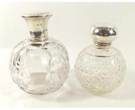 A cut glass large scent bottle with silver lid, Sheffield 1922 and another with silver lid but no collar