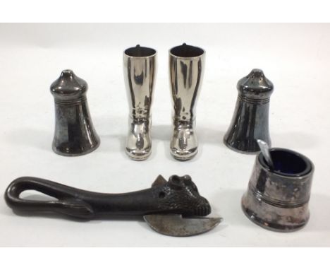 A Victorian bully beef bulls head tin opener, a pair of spirit boot measures and a silver plated cruet set 